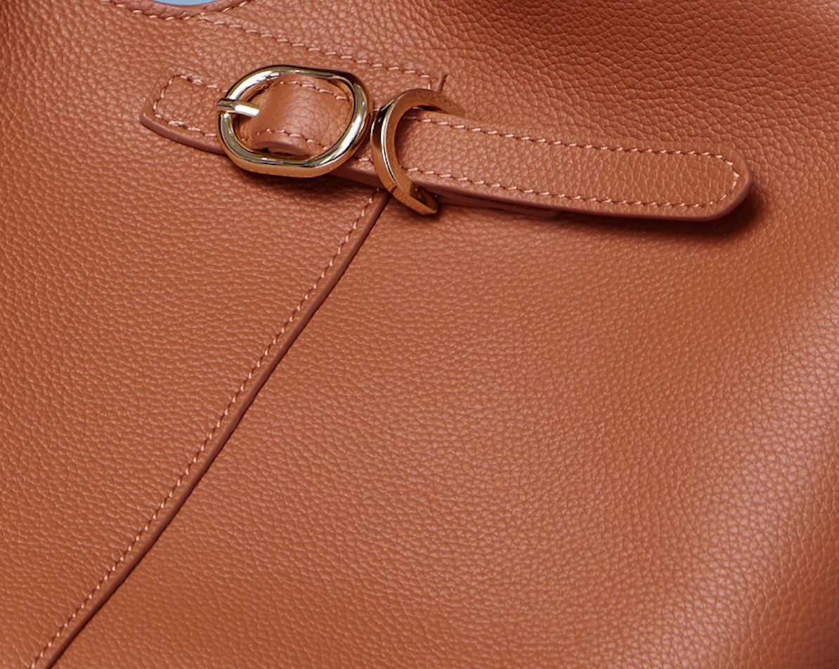 Close up of Florel Silouette handbag buckle and leather grain