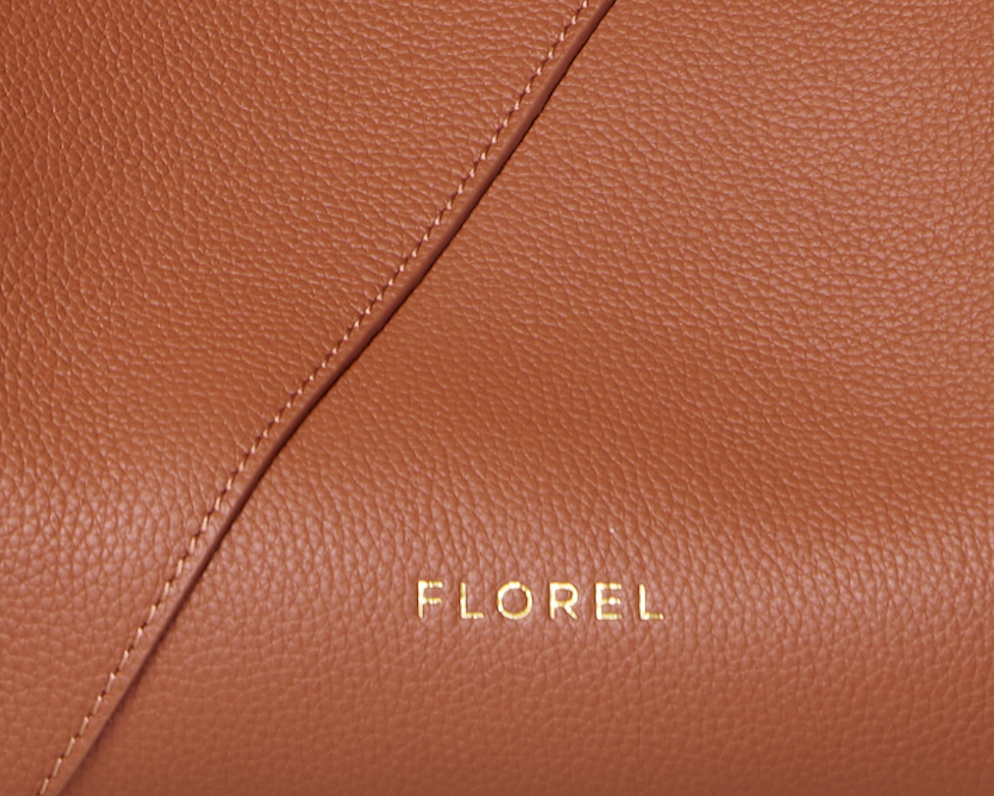Close up of Florel Silouette handbag stamped logo and leather grain